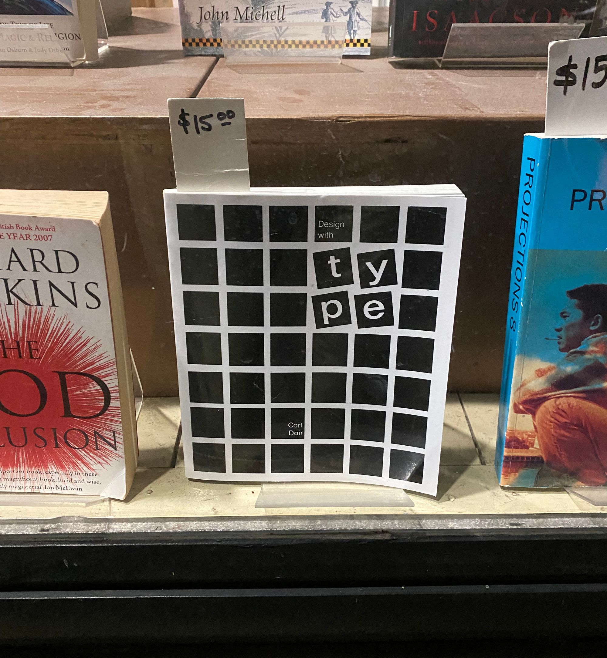 A book about typography displayed in a shop window