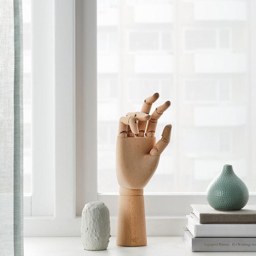 Wooden hand decoration with moveable fingers and thumb