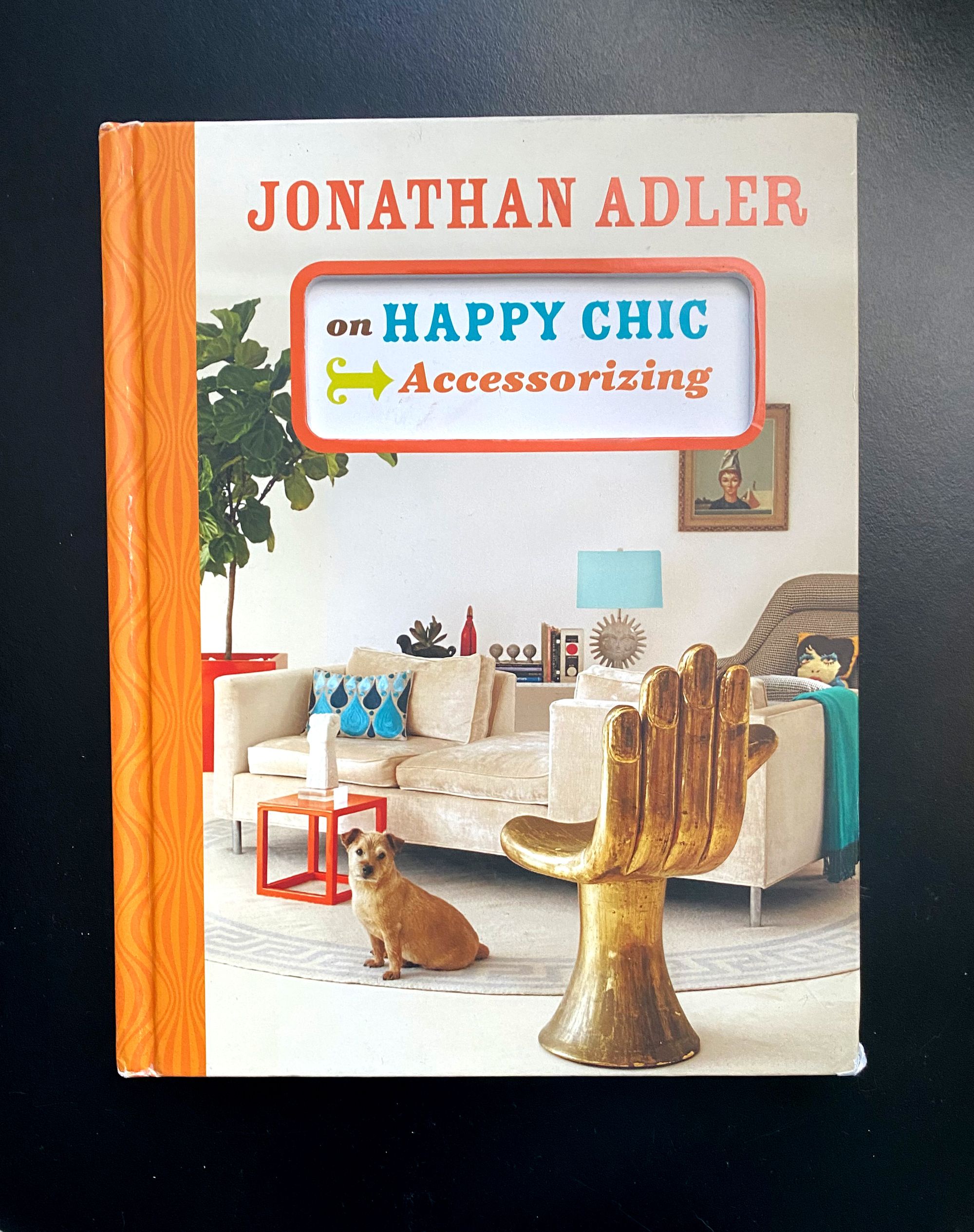 Cover of the book "Jonathan Adler on Happy Chic Accessorizing" featuring Pedro Friedeberg's hand chair