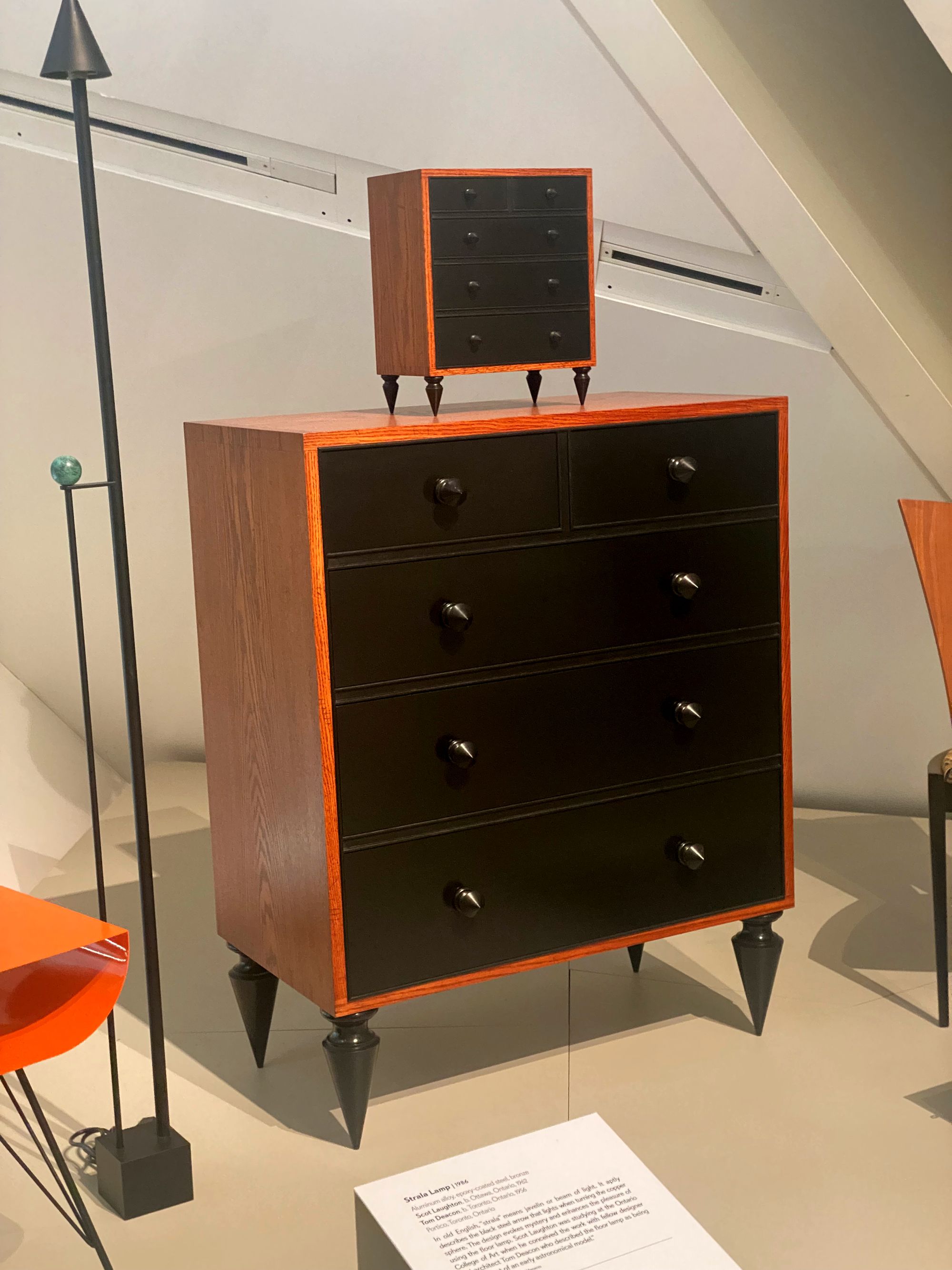 Five-drawer dresser with a miniature version on top.