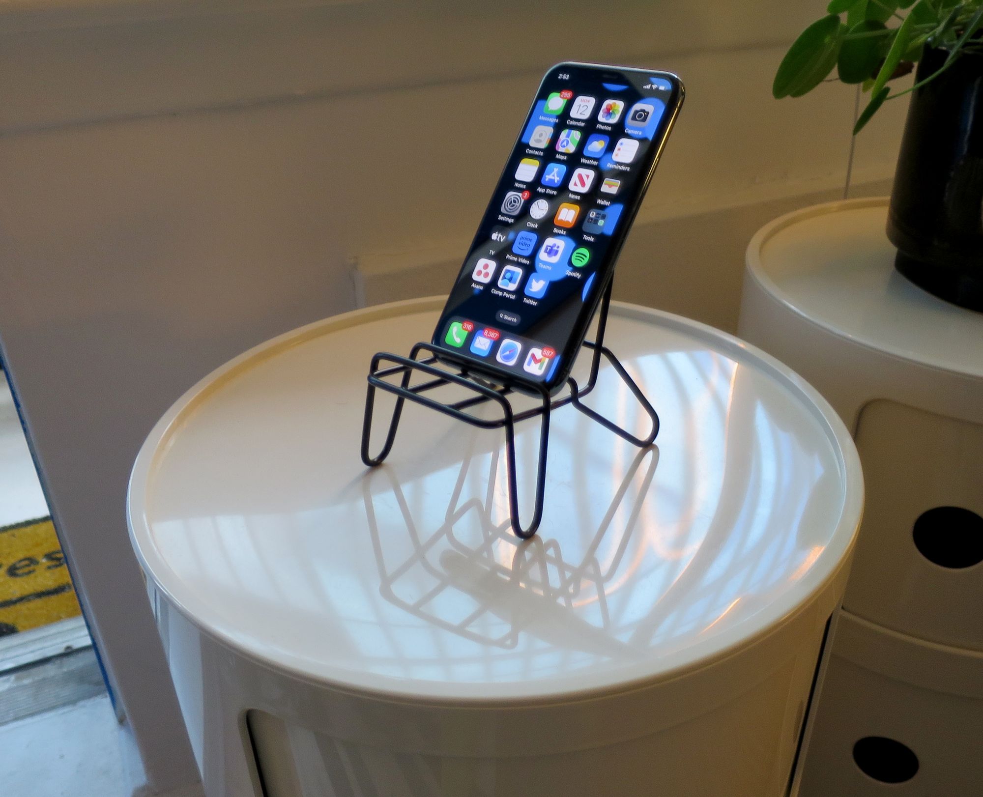 KRUBBET chair holding an iPhone.