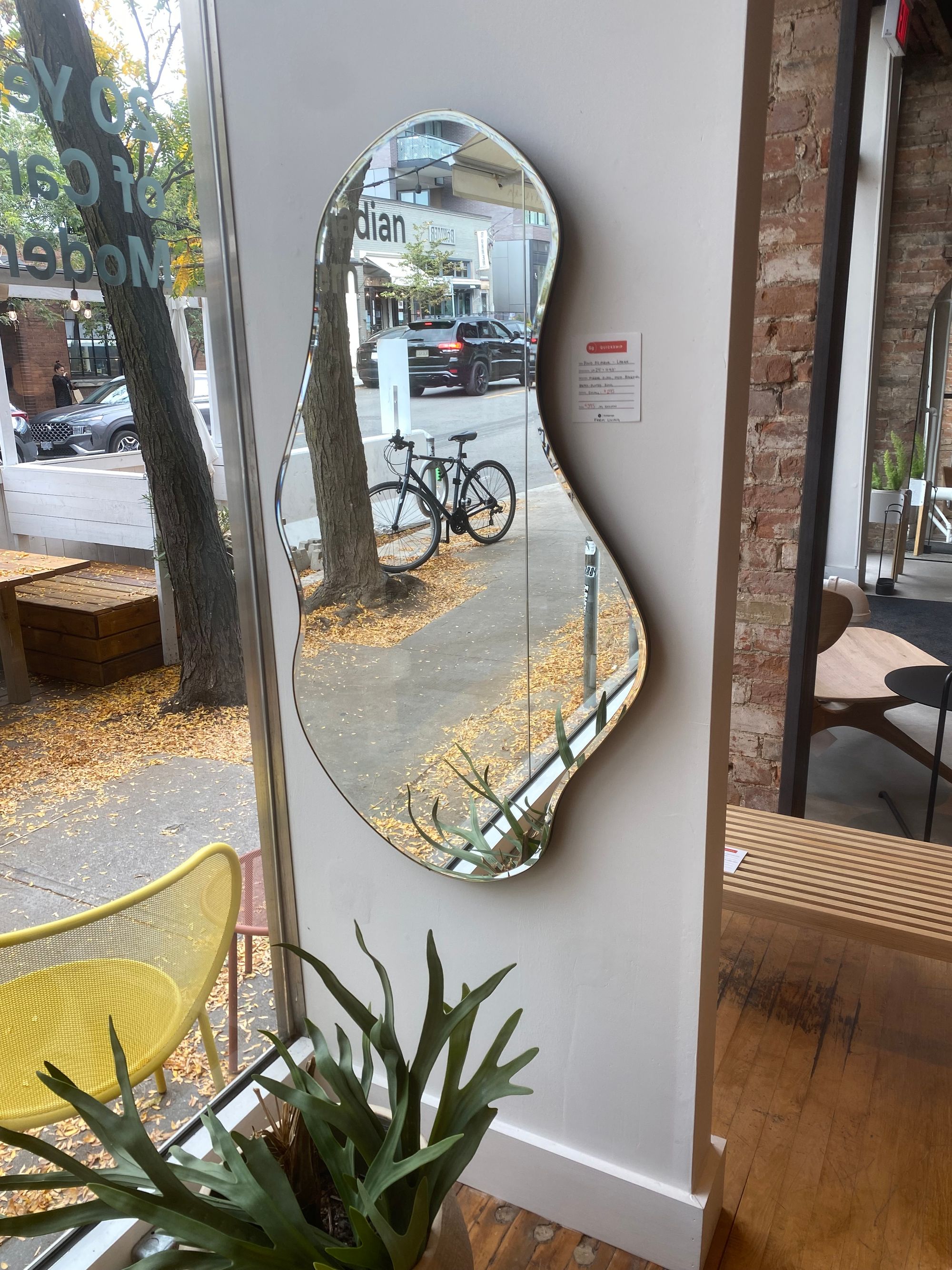 Mirror with curvy edges on display at Stylegarage.