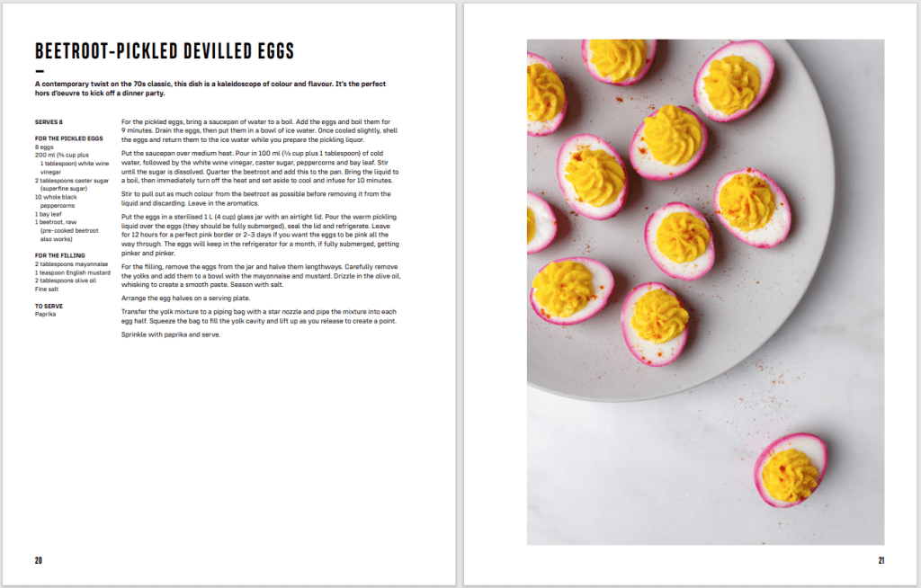 Beetroot Pickled Devilled Eggs recipe on the left page, gorgeous overhead photo of it fully prepared on the right.