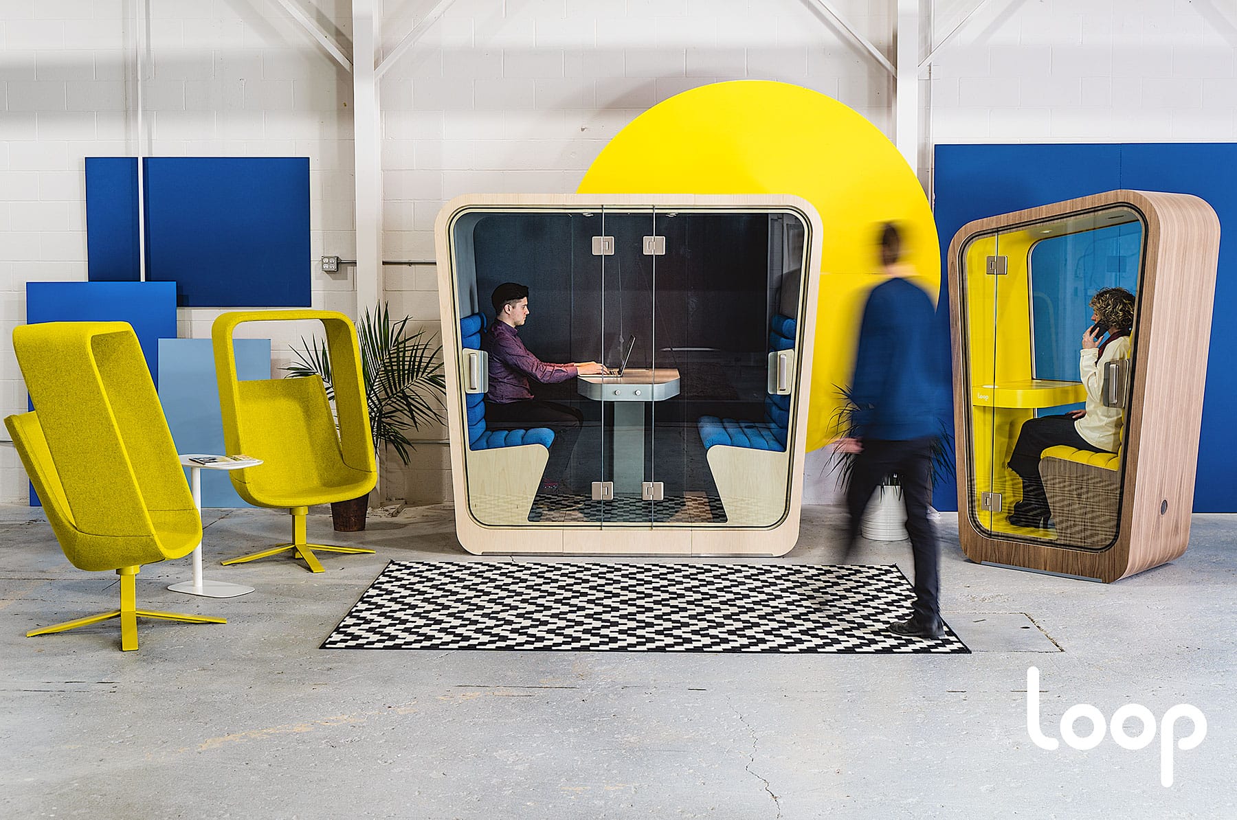 Spacious office with a four-person privacy pod and one-person version as well.