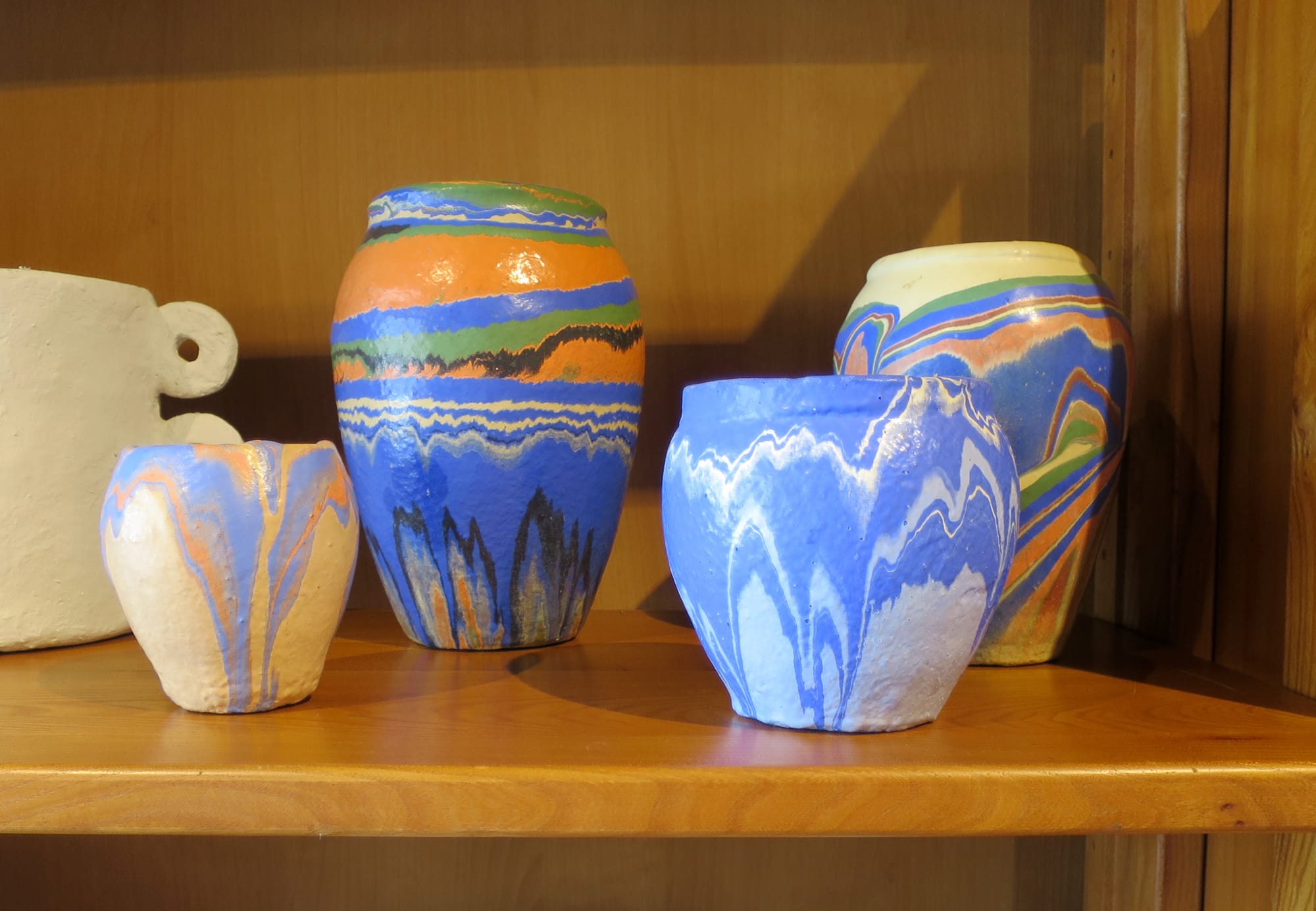 Examples of Ozark roadside pottery on a shelf.