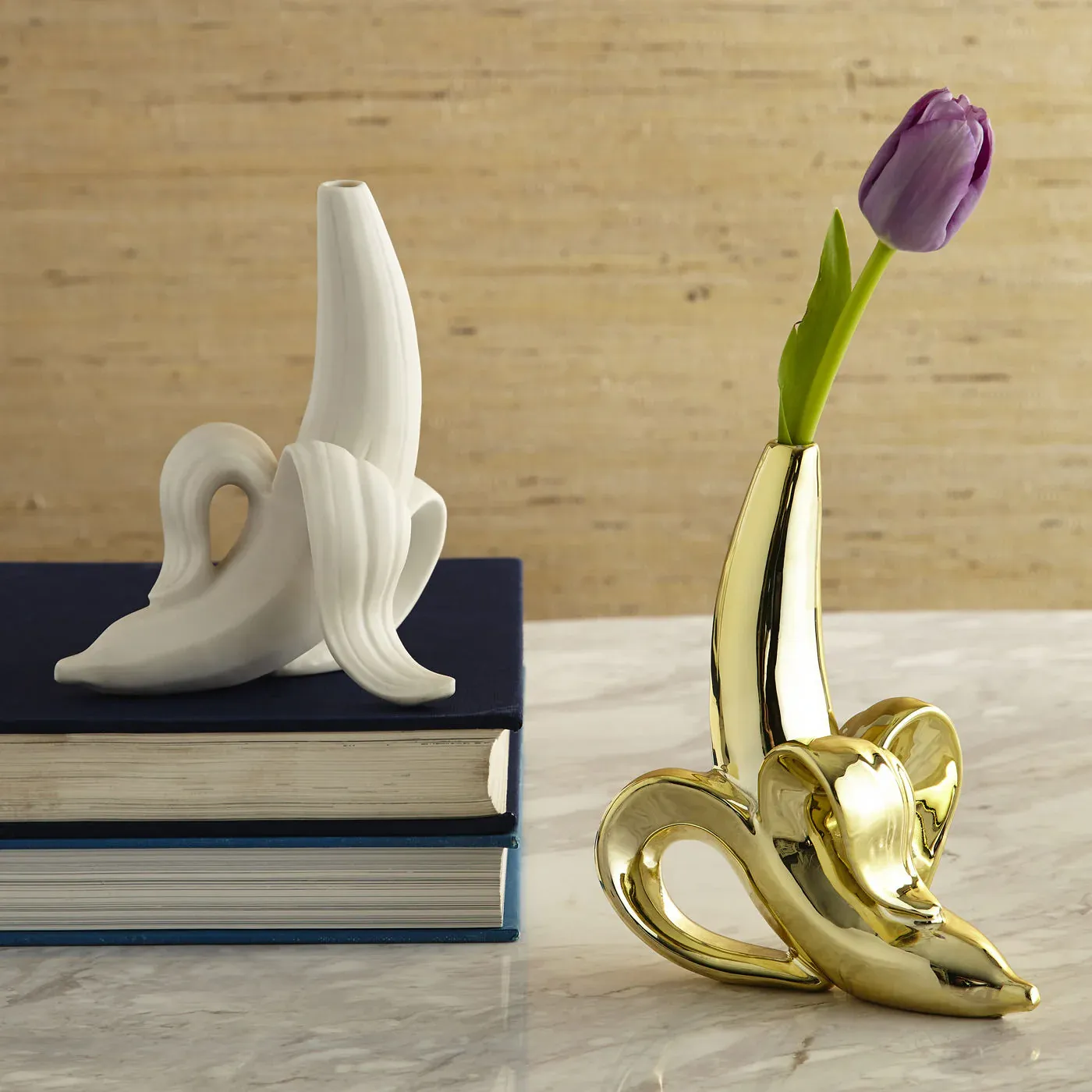 Banana bud vases, one with a tulip in it