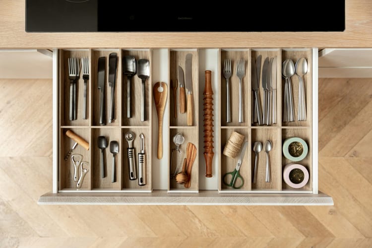 Neatly organized cutlery drawer.