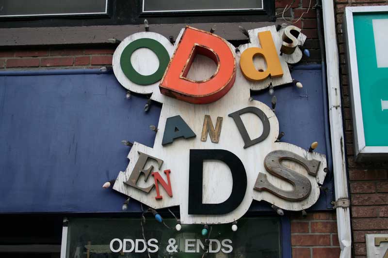 "Odds and Ends" shop signage, made up of mismatched letters.