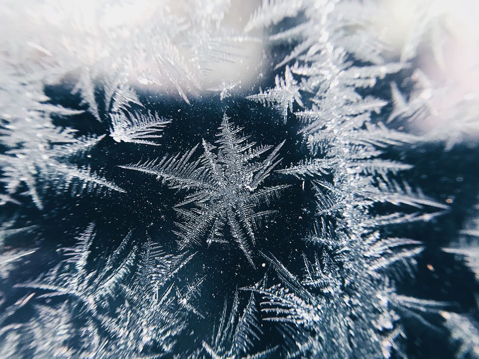 Frost patterns on a window pane.