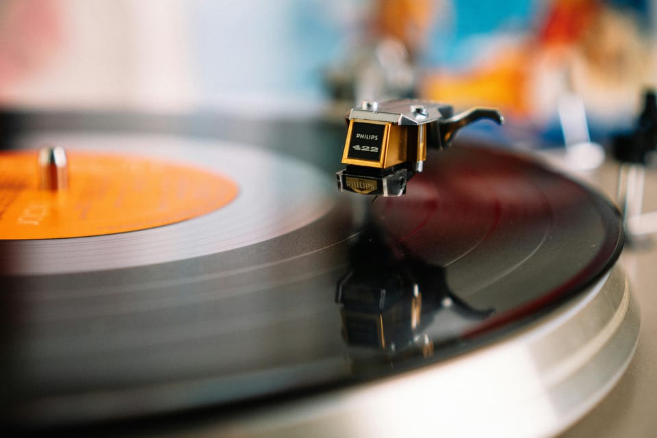 Close-up of a record on a turntable, the needle about to land on the vinyl.