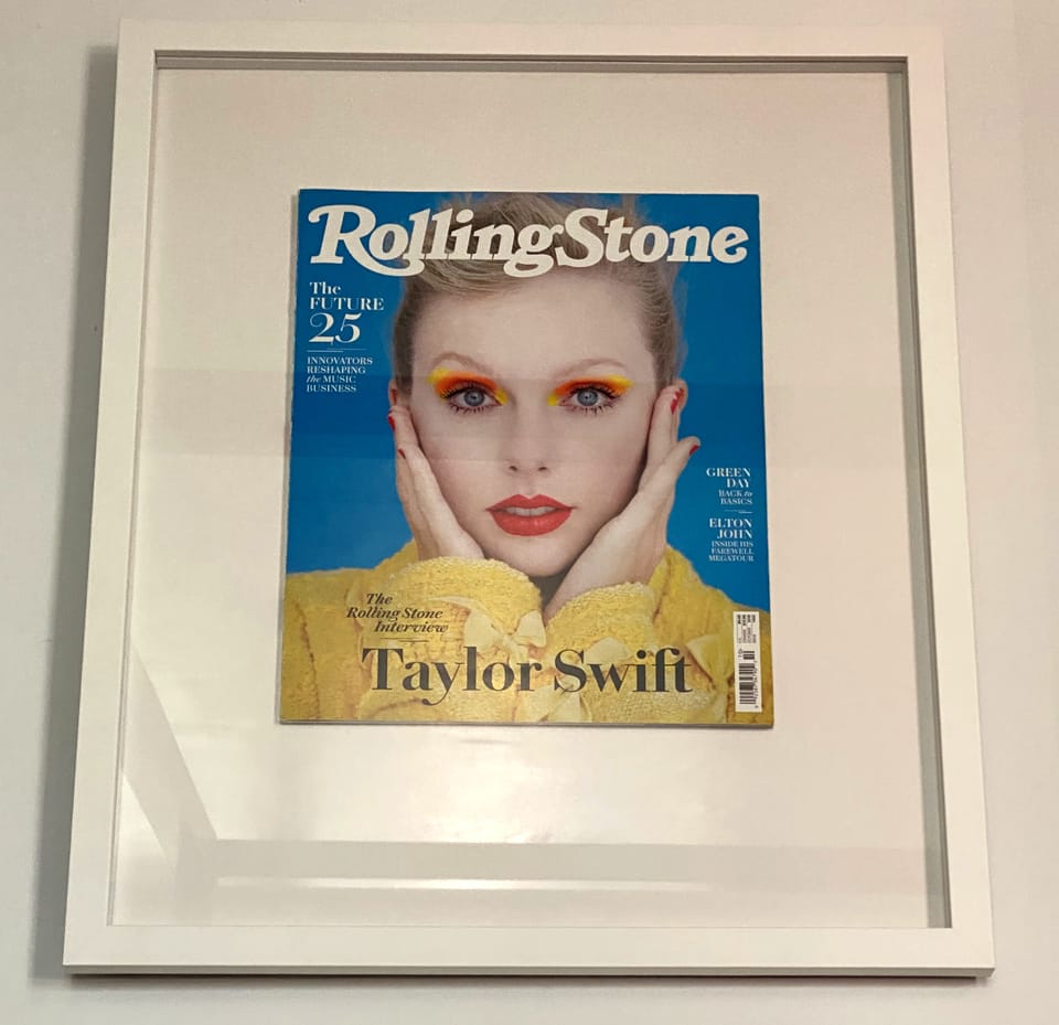 Framed Rolling Stone magazine featuring Taylor Swift on the cover.